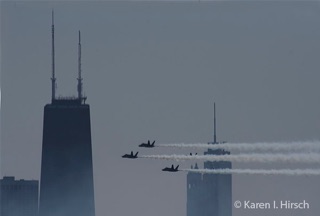 3 jets passing by the Chicago skyline
